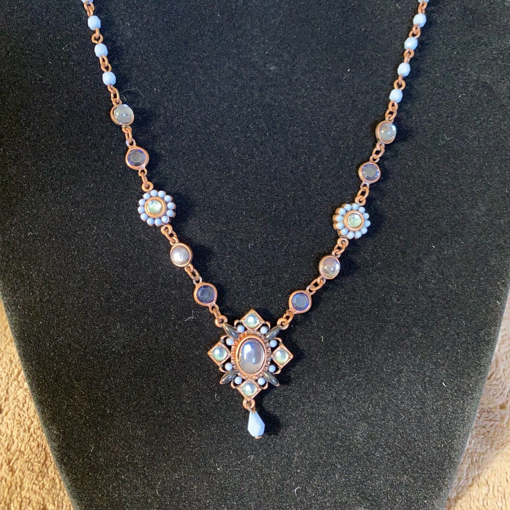 Beautiful blue and gold dangle necklace.